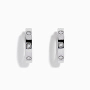 The 925 Sterling Silver Diamond Huggie Earrings feature three round diamonds set evenly along each polished hoop, shown against a white background.