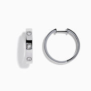 The 925 Sterling Silver Diamond Huggie Earrings feature three round diamonds set evenly along each polished hoop, shown against a white background.