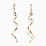 The 14K Yellow Gold Swirl Linear Drop Earrings feature a long, twisted spiral design and are shown against a plain white background.