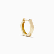 A pair of minimalist 14K Yellow Gold Hexagon Huggies displayed upright on a plain white background.