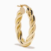 A pair of 14K Yellow Gold Twist Tube Oblong Earrings displayed on a plain white background.