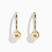A pair of 14K yellow gold tube hoops with bead accents, displayed against a plain white background.