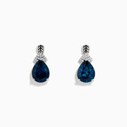 The Ocean Bleu 925 Sterling Silver London Blue Topaz and Diamond Earrings showcase teardrop-shaped London Blue Topaz stones, accented with sparkling diamonds and a leaf-patterned sterling silver setting.