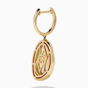 These 14K yellow gold drop earrings feature sky blue topaz and mother of pearl doublets, accented with diamond-studded hooks for a sparkling finish.