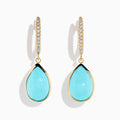 The 14K Yellow Gold Turquoise and Diamond Drop Earrings feature teardrop turquoise stones and sparkling diamonds along the hooks, shown on a white background.
