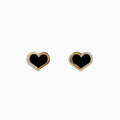 The Eclipse 14K Yellow Gold Onyx and Diamond Heart Earrings feature heart-shaped studs with black onyx centers and a border of sparkling diamonds, displayed on a plain white background.