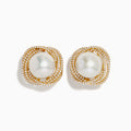 The 14K Yellow Gold Diamond Fresh Water Pearl Earrings showcase large freshwater pearls at the center, framed by sparkling diamonds in an elegant wavy square design, set against a white background.