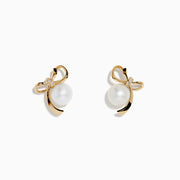 14K Yellow Gold Diamond Fresh Water Pearl Earrings feature ribbon-shaped designs, each adorned with a freshwater pearl and a small diamond at the top, displayed against a plain white background.
