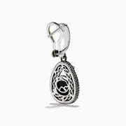 The Eclipse 925 Sterling Silver and 18K Yellow Gold Onyx Earrings feature teardrop black stones set with twisted rope details and gold prongs, shown against a white background.