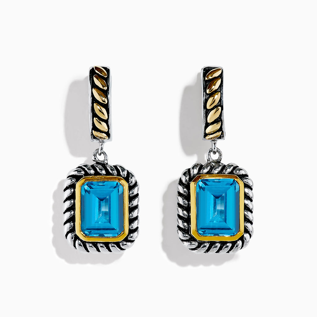 The Ocean Bleu 925 Sterling Silver and 18K Yellow Gold Blue Topaz Earrings feature rectangular gemstones in a twisted rope design with gold-accented posts, shown against a white background.