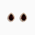 A pair of 14K Rose Gold Garnet and Diamond Earrings featuring teardrop-shaped deep red gemstones encircled by sparkling white diamonds, beautifully displayed on a white background.