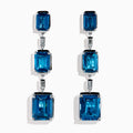 14K White Gold Blue Topaz and Diamond Linear Drop Earrings featuring three rectangular blue topaz gems and two small vertical diamonds in an alternating, linear pattern.