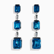 14K White Gold Blue Topaz and Diamond Linear Drop Earrings featuring three rectangular blue topaz gems and two small vertical diamonds in an alternating, linear pattern.