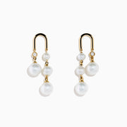 The 14K Yellow Gold Fresh Water Pearl and Diamond Drop Earrings feature a stud with a single diamond and three dangling freshwater pearls, displayed against a white background.