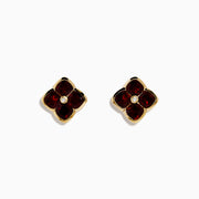 14K Yellow Gold Garnet and Diamond Earrings featuring four-petaled flower studs with deep red garnet petals and a small diamond center, shown on a white background.