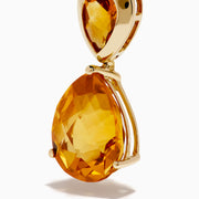 The Sunset 14K Yellow Gold Citrine Drop Earrings feature large teardrop-shaped orange citrine stones with smaller matching gems above, all set against a white background.