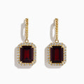 The Bordeaux 14K Yellow Gold Garnet and Diamond Earrings feature large rectangular deep red garnets surrounded by a border of sparkling diamonds, elegantly displayed against a white background.
