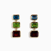 Mosaic 14K yellow gold earrings featuring vertically arranged square-cut blue topaz, garnet, peridot, and diamond drops are displayed against a white background.