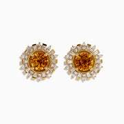The 14K Yellow Gold Citrine and Diamond Sunburst Stud Earrings feature round citrine centers with a sunburst of sparkling diamonds and gold accents.