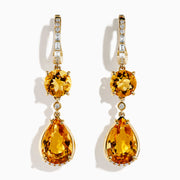 The 14K Yellow Gold Citrine and Diamond Dangle Earrings feature round and teardrop citrine gemstones with diamond accents on the clasps and between the stones, shown against a white background.