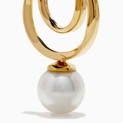 The 14K Yellow Gold Fresh Water Pearl Dangle Earrings feature a double circular design with luminous freshwater pearl drops, shown against a white background.