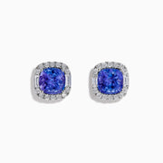 The Effy Hematian 18K White Gold Tanzanite and Diamond Cushion Halo Stud Earrings feature vibrant deep blue cushion-cut tanzanites, each encircled by a halo of sparkling white diamonds.