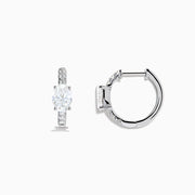 Lab Grown Diamond Oval Huggie Earrings in 14K White Gold, featuring sparkling lab diamonds set along sleek hoops, displayed on a white background.