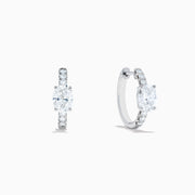 Lab Grown Diamond Oval Huggie Earrings in 14K White Gold, featuring sparkling lab diamonds set along sleek hoops, displayed on a white background.