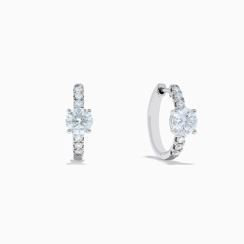 Lab Grown Diamond Round Huggie Earrings in 14K White Gold, featuring a central round diamond with vertical rows of smaller diamonds, displayed on a plain white background.