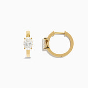 Lab Grown Diamond Oval Huggie Earrings in 14K Yellow Gold, each featuring a single oval lab grown diamond, displayed on a plain white background.