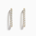 A pair of Lab Grown Round Diamond 7.00ct Inside Out Hoop Earrings in 14K yellow gold, displayed vertically against a plain white background.