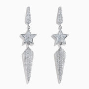 The 18K White Gold Diamond Shooting Star Linear Drop Earrings showcase a central star design with a long, pointed diamond-encrusted dangle, displayed on a plain white background.