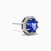 The Nahla Siri 14K Gold Octagon Cut Tanzanite and Diamond Earrings feature octagonal tanzanite gemstones encircled by small clear diamonds, set against a plain white background.