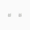 A pair of 14 Karat white gold stud earrings featuring 0.63TCW round diamonds is displayed on a simple white background, highlighting their timeless elegance.