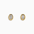 Lab Grown Oval Diamond 2.50ct Bezel Stud Earrings in 14K Yellow Gold, shown against a white background.