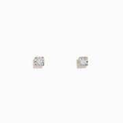 A pair of 14K two tone white & yellow gold diamond solitaire stud earrings, 0.10 TCW, shown on a plain white background.