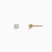 14K two-tone white and yellow gold diamond solitaire stud earrings, 0.10 TCW, shown from the front and side on a white background.