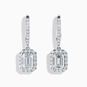 The Lab Grown Diamond Emerald Cut Dangle Earrings in 14K White Gold showcase emerald cut lab grown centers with a halo of round diamonds and diamond-encrusted hooks, elegantly presented against a white background.