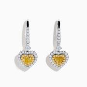 The Canare 18K Two Tone Gold White & Yellow Diamond Heart Earrings feature heart-shaped yellow stones, a halo of white diamonds, and diamond-accented hooks for elegant sparkle.
