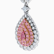 The 18K Two Tone White and Pink Diamond Drop Earrings feature a teardrop shape with pink gemstones, encircled by white diamonds and set in white metal with diamond-accented hooks, elegantly displayed against a white background.