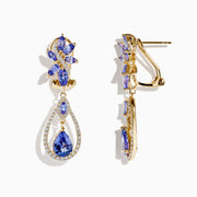 14K yellow gold tanzanite and diamond earrings featuring marquise and pear-shaped blue stones, accented with diamonds in a floral cluster at the top and a teardrop dangle design below.