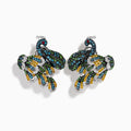 The 14K White Gold Multi Color Diamond and Ruby Peacock Earrings feature ornate peacock designs with blue, green, yellow, and clear gemstones and ruby eyes, elegantly displayed on a white background.