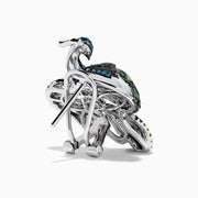 The 14K White Gold Multi Color Diamond and Ruby Peacock Earrings feature ornate peacock designs with blue, green, yellow, and clear gemstones and ruby eyes, elegantly displayed on a white background.