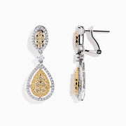 The Canare` 14K Two Tone Yellow and White Diamond Earrings showcase yellow diamonds in teardrop and marquise shapes, each bordered by white diamonds, all set against a white background.