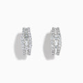 The Classique 14K White Gold Diamond Hoop Earrings feature rows of rectangular and round-cut diamonds, offering a sparkling and timeless look, beautifully displayed on a plain white background.