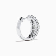 The Classique 14K White Gold Diamond Hoop Earrings feature rows of rectangular and round-cut diamonds, offering a sparkling and timeless look, beautifully displayed on a plain white background.