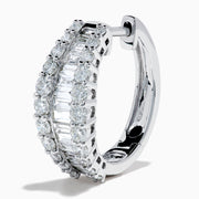 The Classique 14K White Gold Diamond Hoop Earrings feature rows of rectangular and round-cut diamonds, offering a sparkling and timeless look, beautifully displayed on a plain white background.
