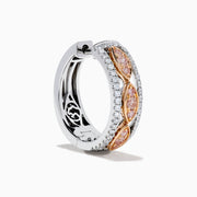 The 14K Two-Tone Gold Pink and White Diamond Huggie Earrings feature marquise-shaped pink gems set in gold on a silver base, accented by white stones, shown against a white background.