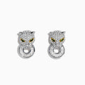 Signature 14K Two Tone Gold Emerald and Diamond Earrings feature jeweled panther heads with emerald and yellow eyes, diamond accents, and circular diamond-encrusted rings in their mouths, set against a white background.