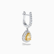 The 18K Two Tone Gold White and Yellow Diamond Drop Earrings feature teardrop-shaped yellow gems encircled by white diamonds, set in two tone gold, with diamond-studded hooks for extra brilliance.